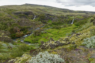 Fototapeta na wymiar Drone view at the waterfalls of Gjain in Iceland