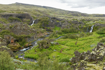 Fototapeta na wymiar Drone view at the waterfalls of Gjain in Iceland