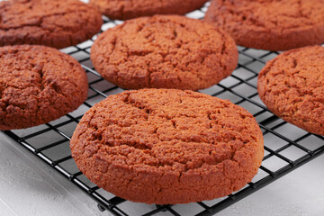 Oatmeal cookies on the cooling rack. Baked crunchy dessert