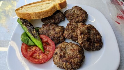 Tradtional Turkish meatballs with vegetables and bread