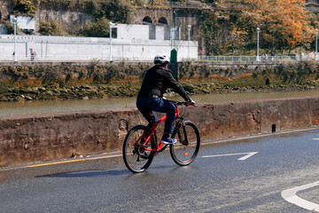 cyclist on the street, bicycle mode of transportation in the city