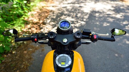 Fototapeta na wymiar Handlebars and speedometer of motorbike