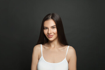 Attractive woman looking at camera and smiling