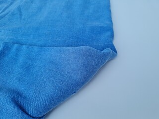 Abstract textured background of blue blanket cloth combined with white