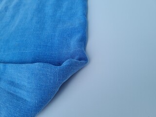 Abstract textured background of blue blanket cloth combined with white