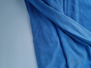 Abstract textured background of blue blanket cloth combined with white