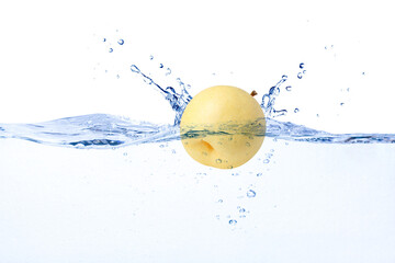 Chinese pear (Yellow pear) falling in water splash isolated on white background.