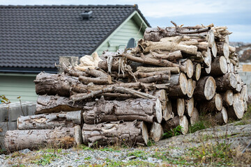 A stack of firewood at a country house. Fuel for furnace heating