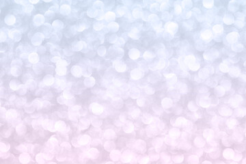 Abstract background with gradient blue and pink blurred small circles.