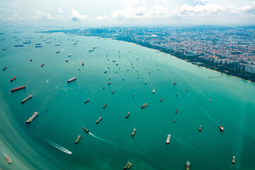  Aerial view from the plane window of the Singapore Harbor which has many ships waiting for loading...