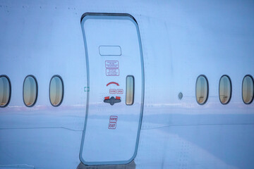 Door of a jet plane, the famous Boeing 777 which is one of the most used airplanes in the world by...