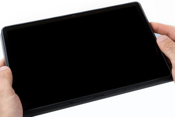 Tablet in hands on a white background