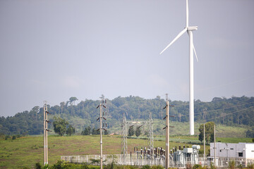 d turbine farm on hill with power substation 