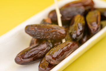 Dried dates with fork for eating