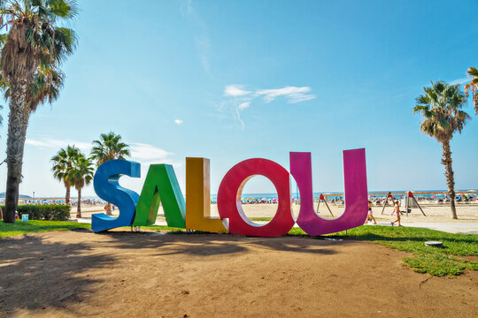 SALOU, SPAIN, AUGUST 23, 2018: Big word Salou varicolored sign at the Llevant Beach in Salou, Spain. Salou is the main place of European tourism