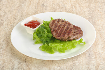 Grilled beef burger cutlet with sauce