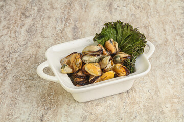 Tasty marinated mussels in the bowl