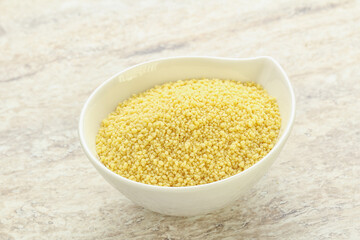 Raw couscous in the bowl
