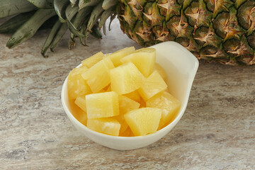 Marinated pineapple slices in the bowl