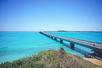 Fototapeta na wymiar 沖縄県の離島宮古島の観光スポット 池間島から青い海と池間大橋を見下ろす絶景