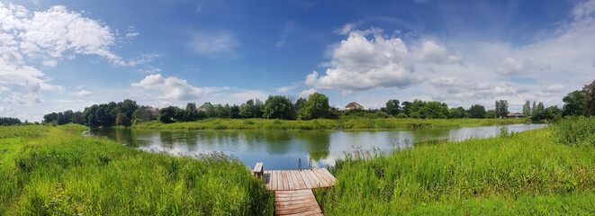Rural summer landscape near Yaroslavl in Russia. Lush green lakeside.