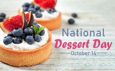 Tarts with blueberries and figs on white wooden table, space for text. Delicious pastries