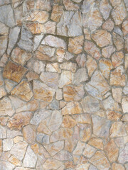 Texture wall of flat stone masonry. Wall cladding with coarse decorative stone. Not a seamless texture. Vertical image.