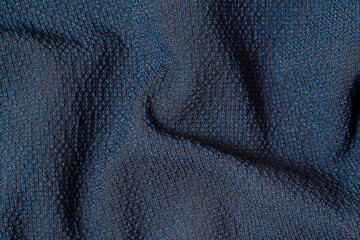 Macro Photo of dark blue fabric texture background. Pattern of dark woven clothing material.