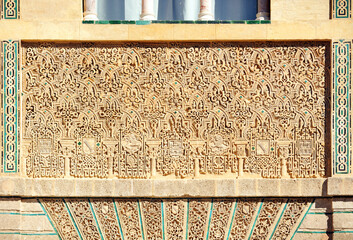 Reliefs on the facade of the Mudejar Palace or King Pedro Palace (Palacio del Rey Don Pedro) in the Alcazar of Seville Andalusia Spain.