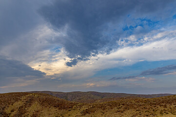 Naklejka premium Mountains and clouds at sunset. Soft focus