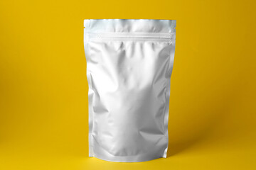 One blank foil package on yellow background