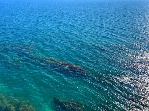 Blue sea waves. The luminescent turquoise waters.