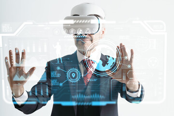 Caucasian man using virtualization business model with VR headset, Virtual Reality technology with business artificial intelligence driving.