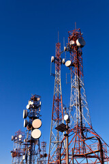 Transmission towers with blue sky in the background
