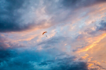 Vatulino Moscow region Russia 08.08.2018 Colorful parachut on the dramatic sky with clouds. Parachute jumps. Active life style.