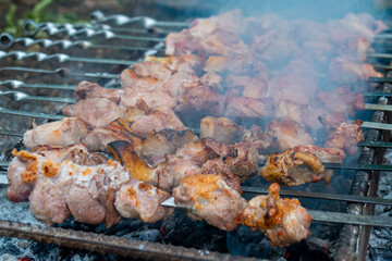 Georgian mtsvadi, Shashlik preparation. Smoking shashlik on the grill. BBQ