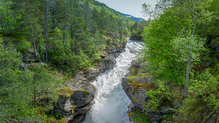 Fototapeta na wymiar Slettafossen, a waterfall in the Rauma river, a little south of Verma (upstream) in Romsdalen in Møre og Romsdal.