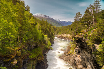 Naklejka na ściany i meble Slettafossen, a waterfall in the Rauma river, a little south of Verma (upstream) in Romsdalen in Møre og Romsdal.