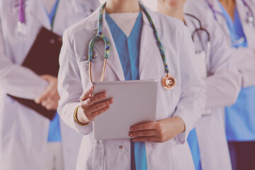 Group of doctors and nurses standing in the hospital room