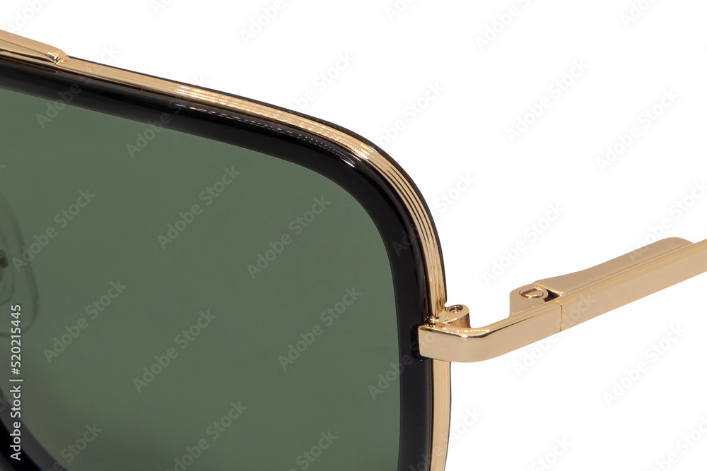 Wall mural gold metal frame square sunglasses green polarized shades for men and women closeup view