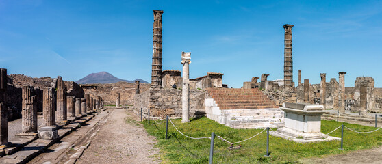 POMPEII, ITALY - MAY 04, 2022 - Colonnade and sculptures of the Temple of Apollo near the Pompeian...