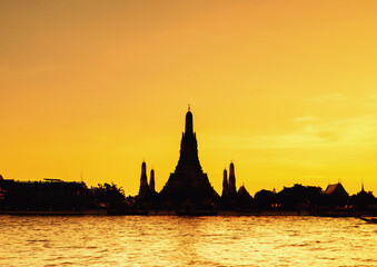 Wat Arun silhouette view at sunset, A Buddhist temple in Bangkok, Thailand, Wat Arun is one of the...