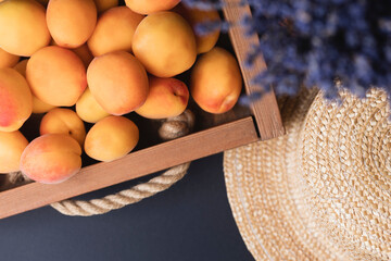 summer background of apricot, lavender and straw hat