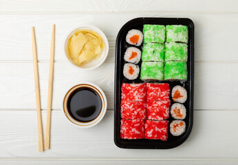 Assorted sushi. Big set of sushi. A variety of Japanese sushi with crab, salmon, eel and caviar on a white wooden table. Top viewCopy space. food delivery