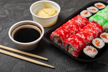 Assorted sushi. Big set of sushi. A variety of Japanese sushi with crab, salmon, eel and caviar on a black marble table. Top viewCopy space. food delivery