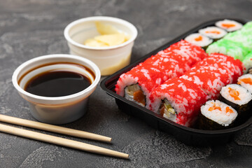 Assorted sushi. Big set of sushi. A variety of Japanese sushi with crab, salmon, eel and caviar on a black marble table. Top viewCopy space. food delivery