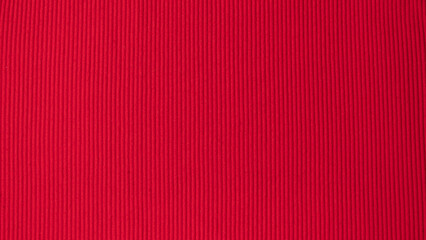 Red textured background with vertical stripes of furrows