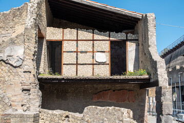 HERCULANEUM, ITALY - MAY 05, 2022 - The half ruined Trellis house in the ancient Roman city of Herculaneum