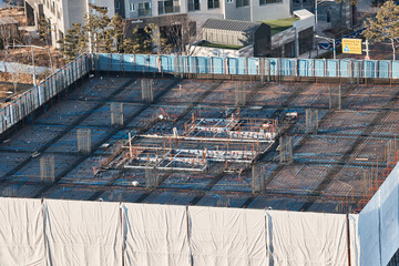 Aerial View of Construction Site with Rebar, Urban Development Background