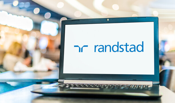 Laptop computer displaying logo of Randstad